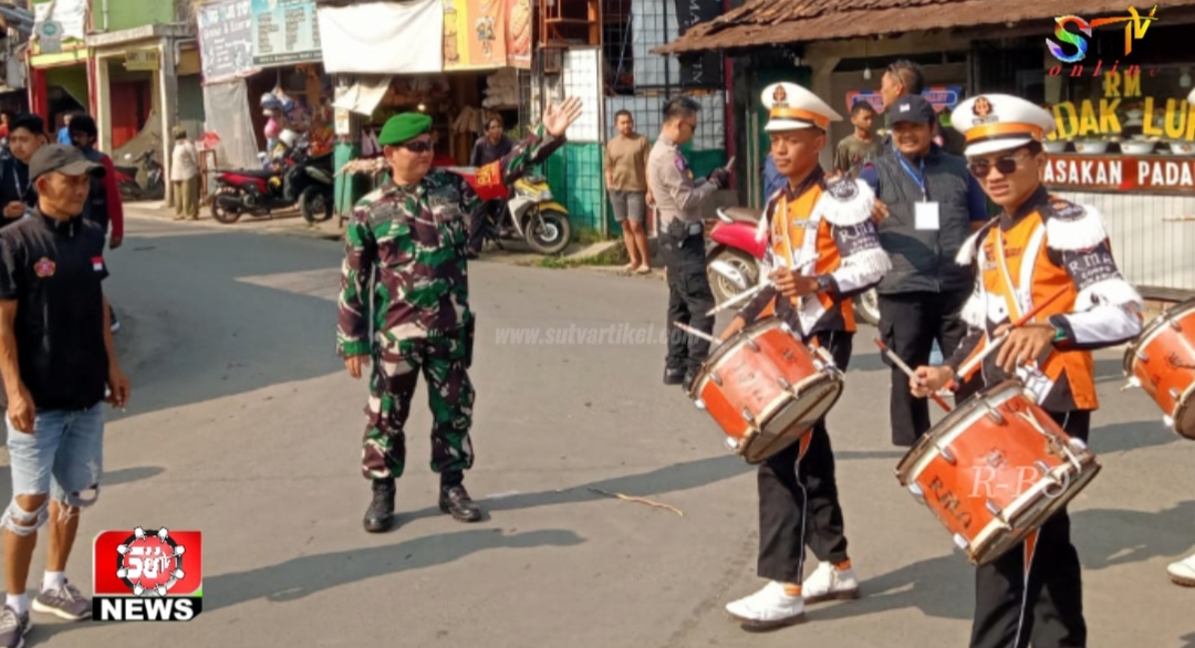 Babinsa Desa Kutasirna Bersinergi Amankan Kegiatan Karnaval Kenaikan Kelas Sekolah Diniyah